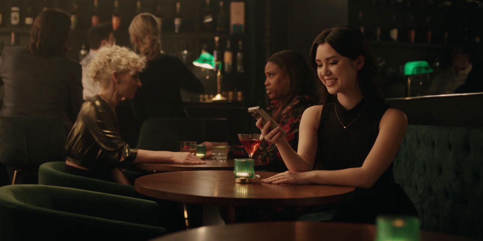 a group of women sitting at a table in a bar