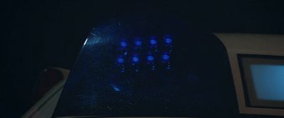 a close up of a blue light in the dark