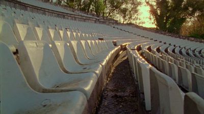 a row of white seats sitting next to each other