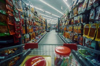 a grocery store aisle filled with lots of food