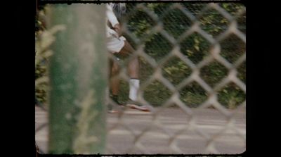 a man holding a tennis racquet on a tennis court