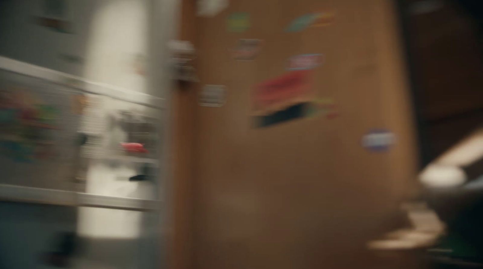 a blurry photo of a refrigerator with magnets on it