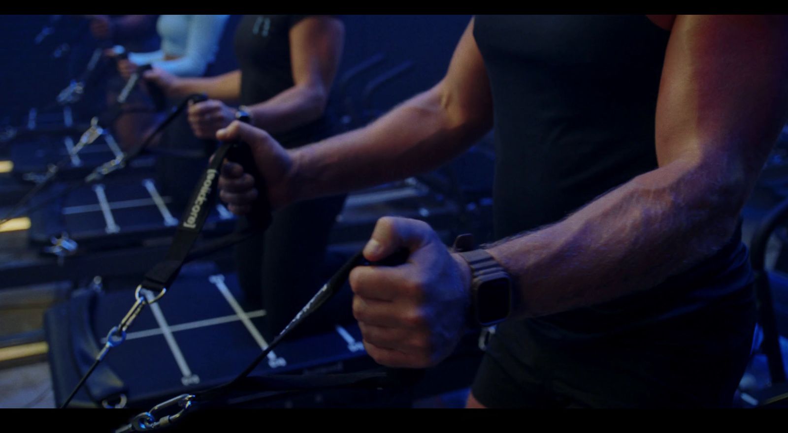 a group of people on exercise bikes in a gym