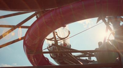 a close up of a metal structure with a sky background