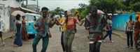 a group of people walking down a street