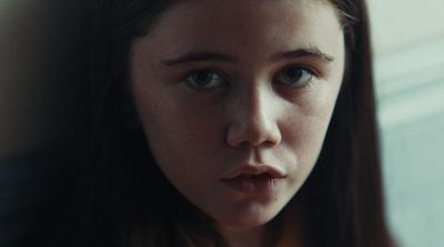 a close up of a person with long hair