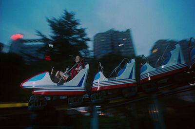 a man riding a roller coaster on a roller coaster