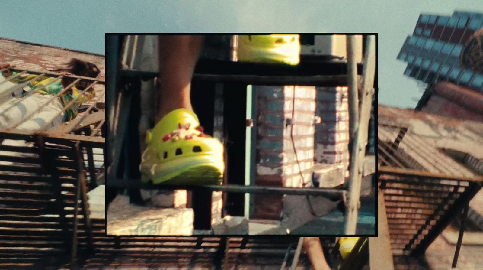 a pair of yellow shoes sitting on top of a ladder