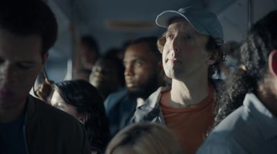 a group of people sitting on a bus