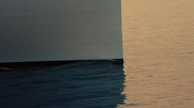 a large white boat in the middle of a body of water