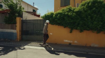 a man riding a skateboard down a street