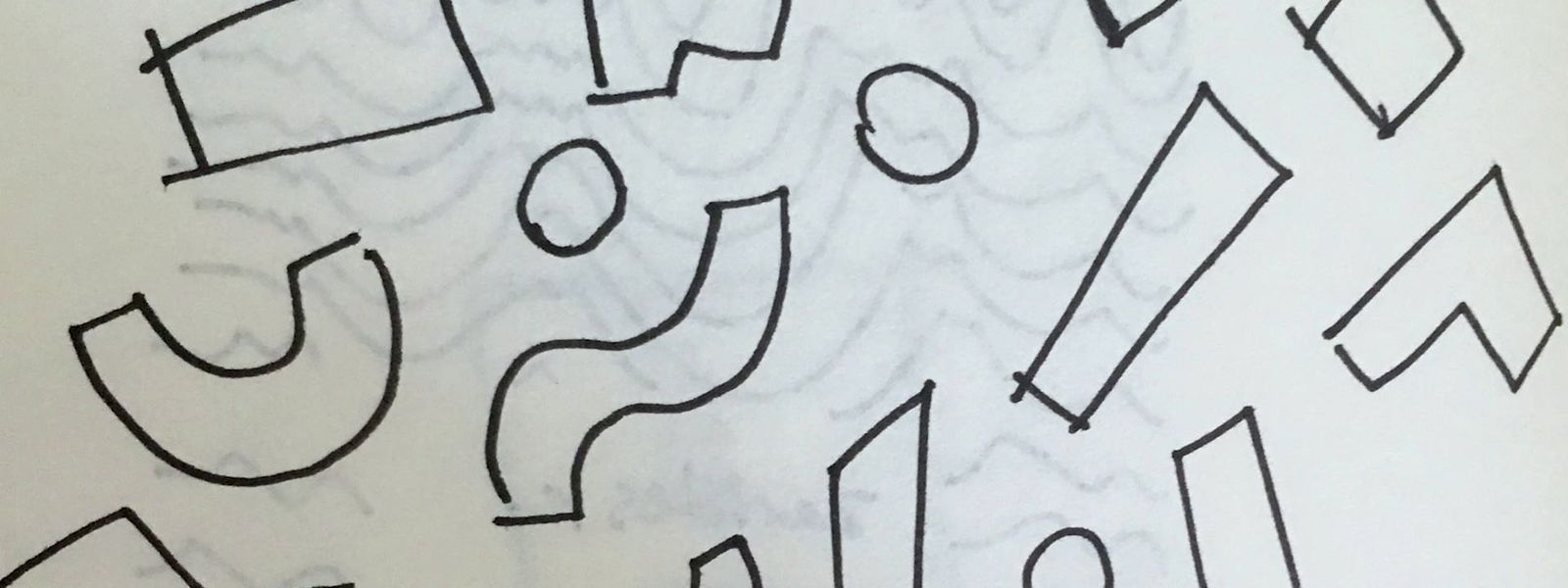 a drawing of letters and numbers on a sheet of paper