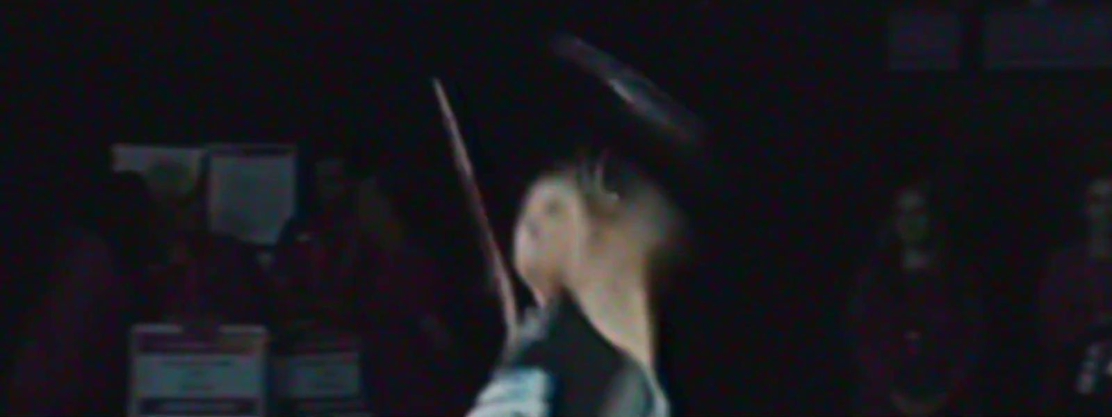 a blurry photo of a person holding a tennis racket