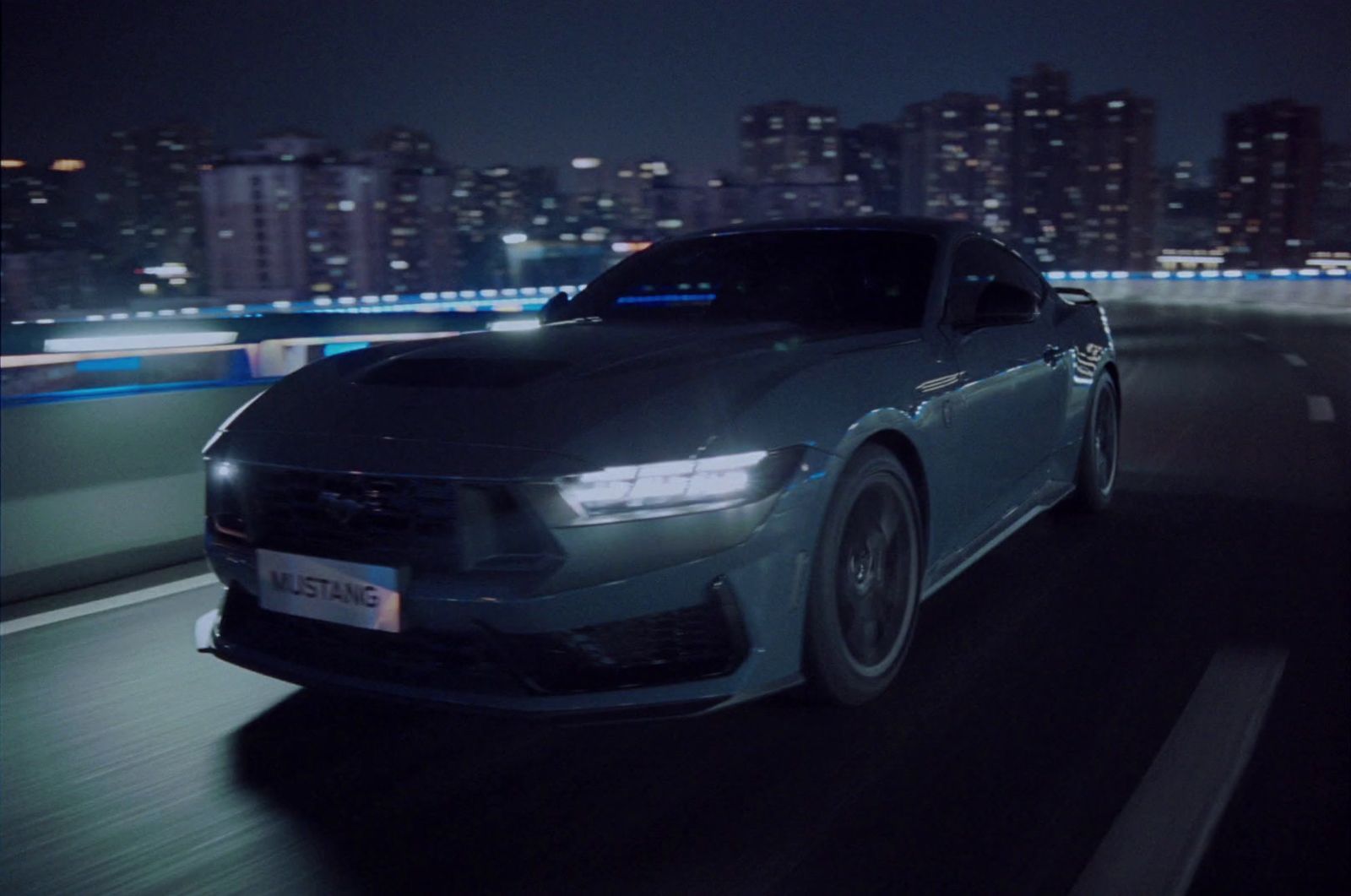 a car driving down a highway at night