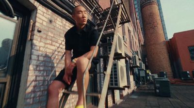 a man sitting on top of a set of stairs