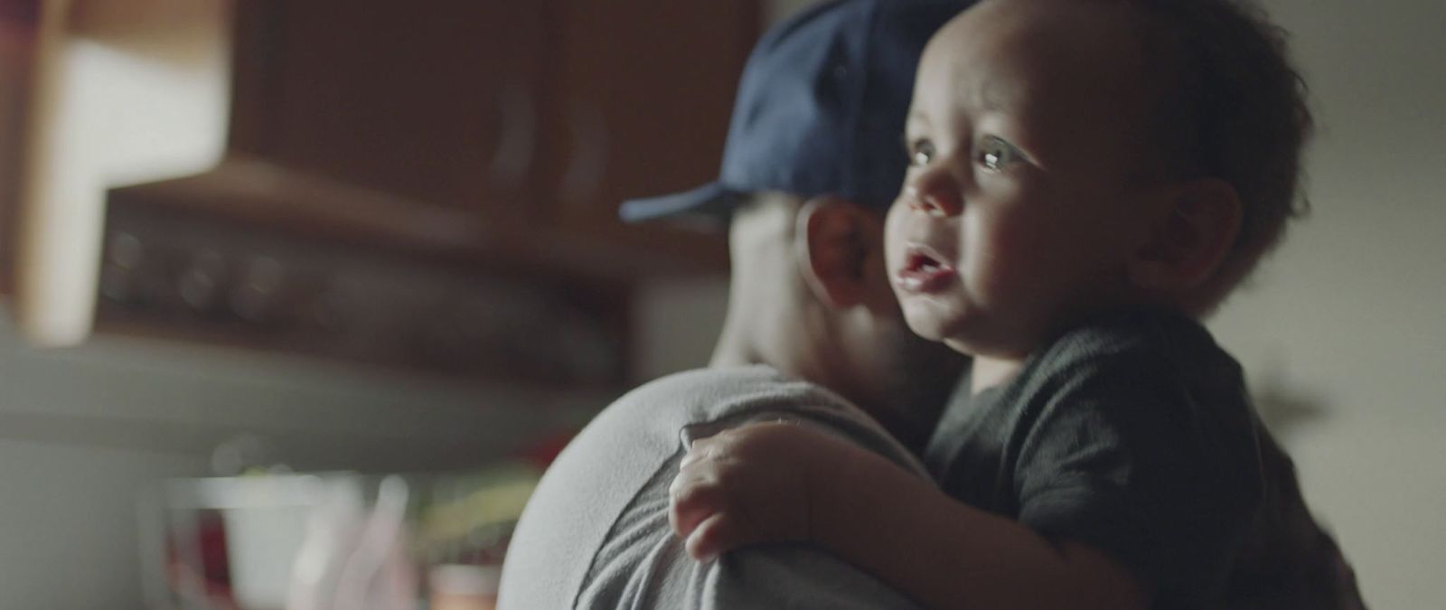 a woman holding a baby in her arms