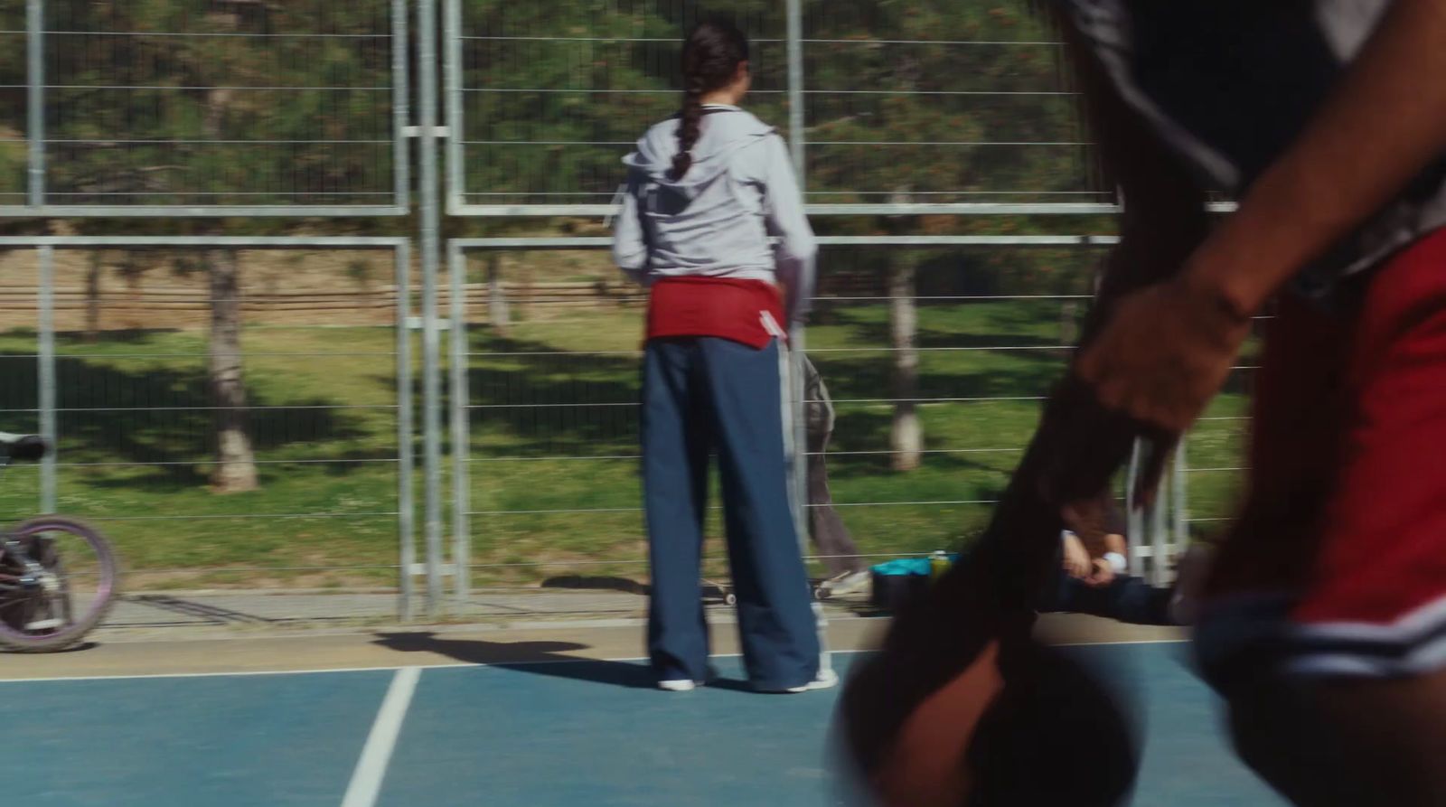 a man holding a tennis racquet on top of a tennis court