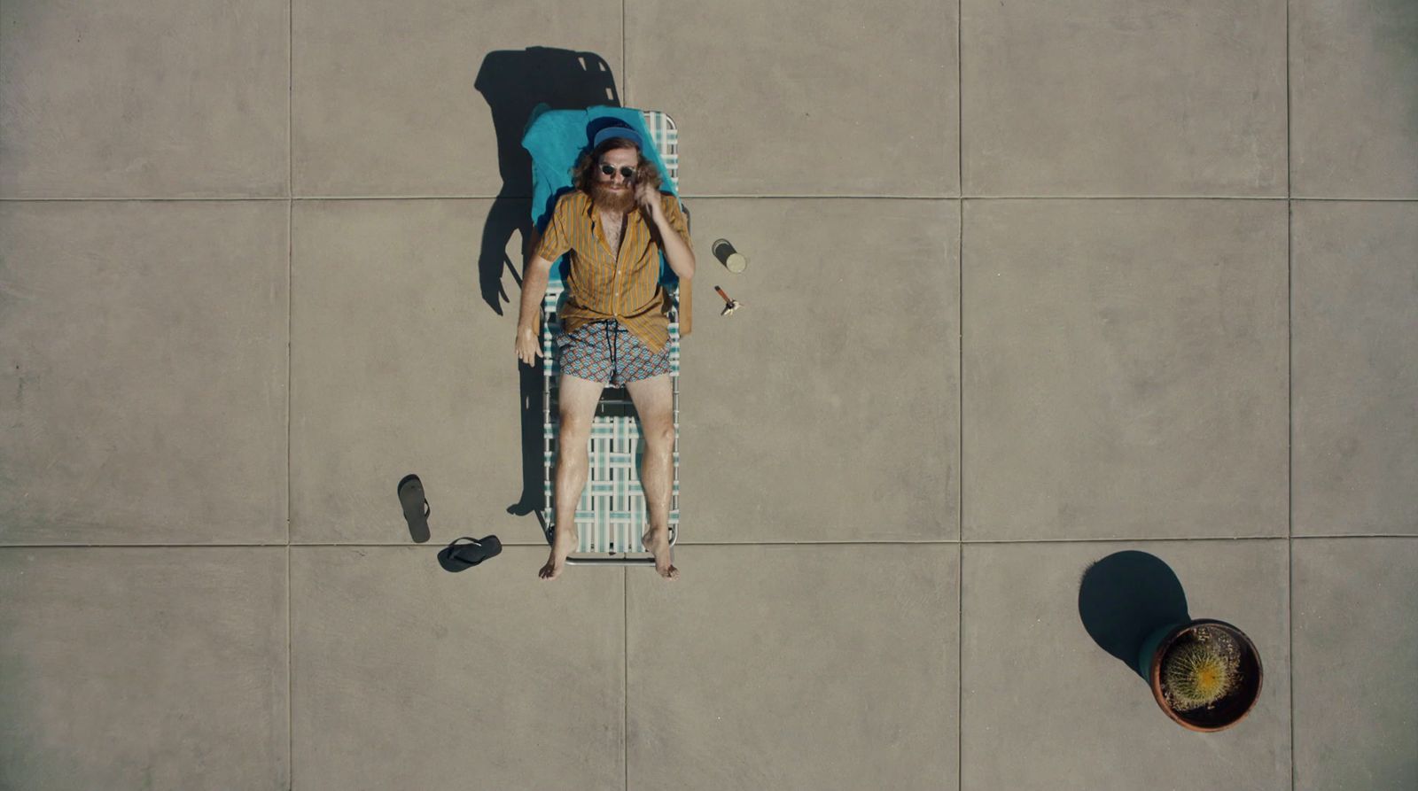 a woman laying on a chair with a backpack on her back