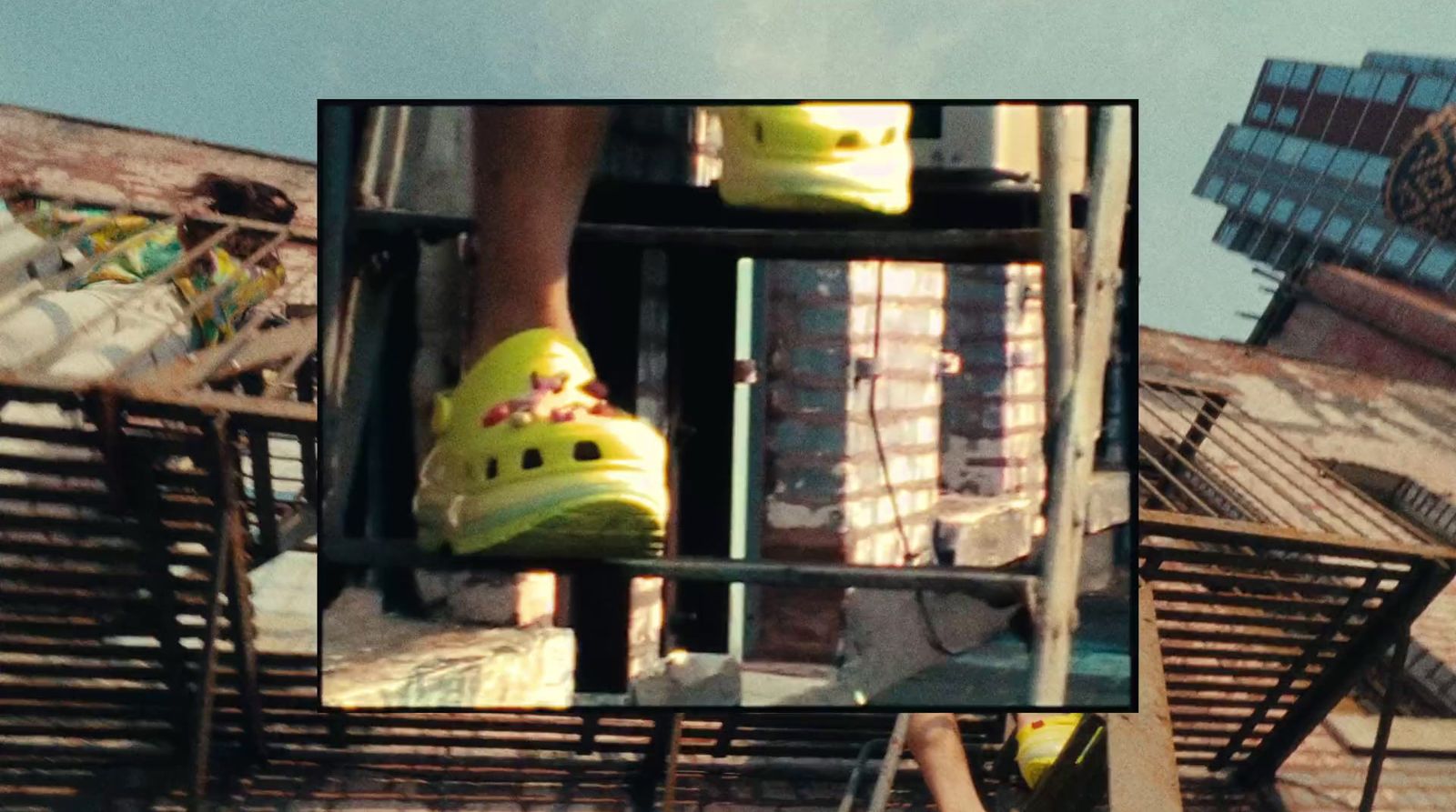 a pair of yellow shoes sitting on top of a building