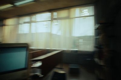 a blurry photo of a computer monitor in a room