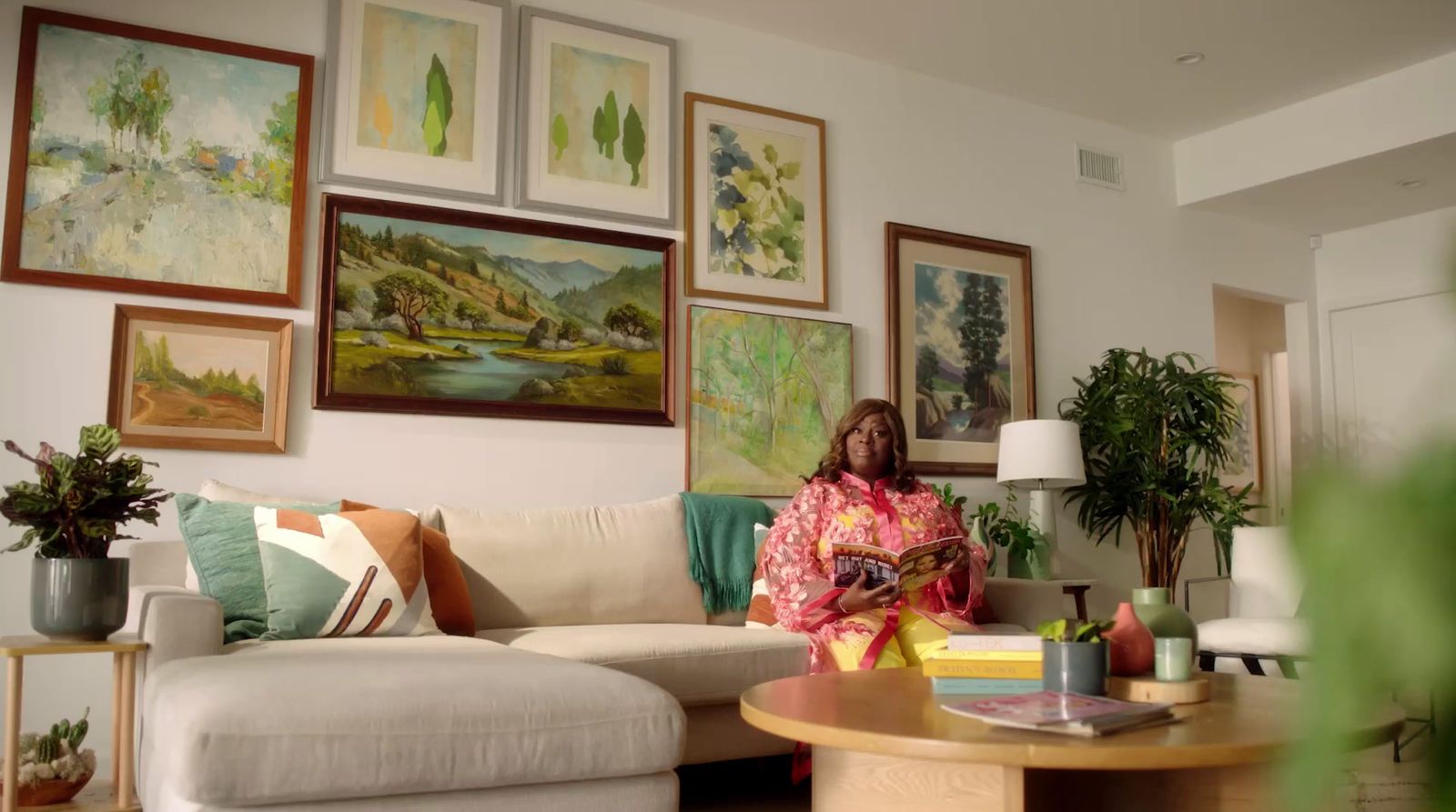 a woman sitting on a couch in a living room