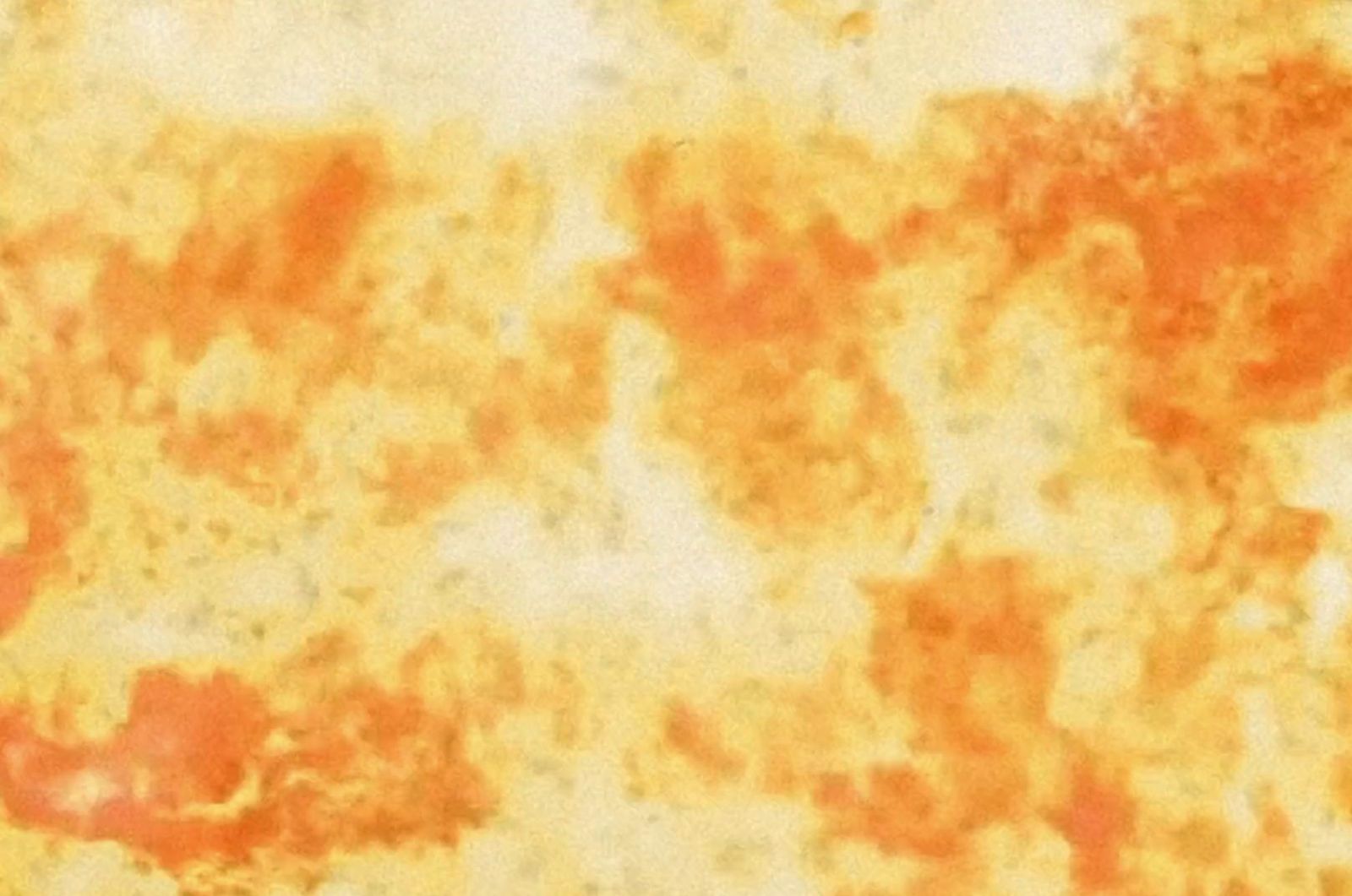 a close up of an orange and yellow background