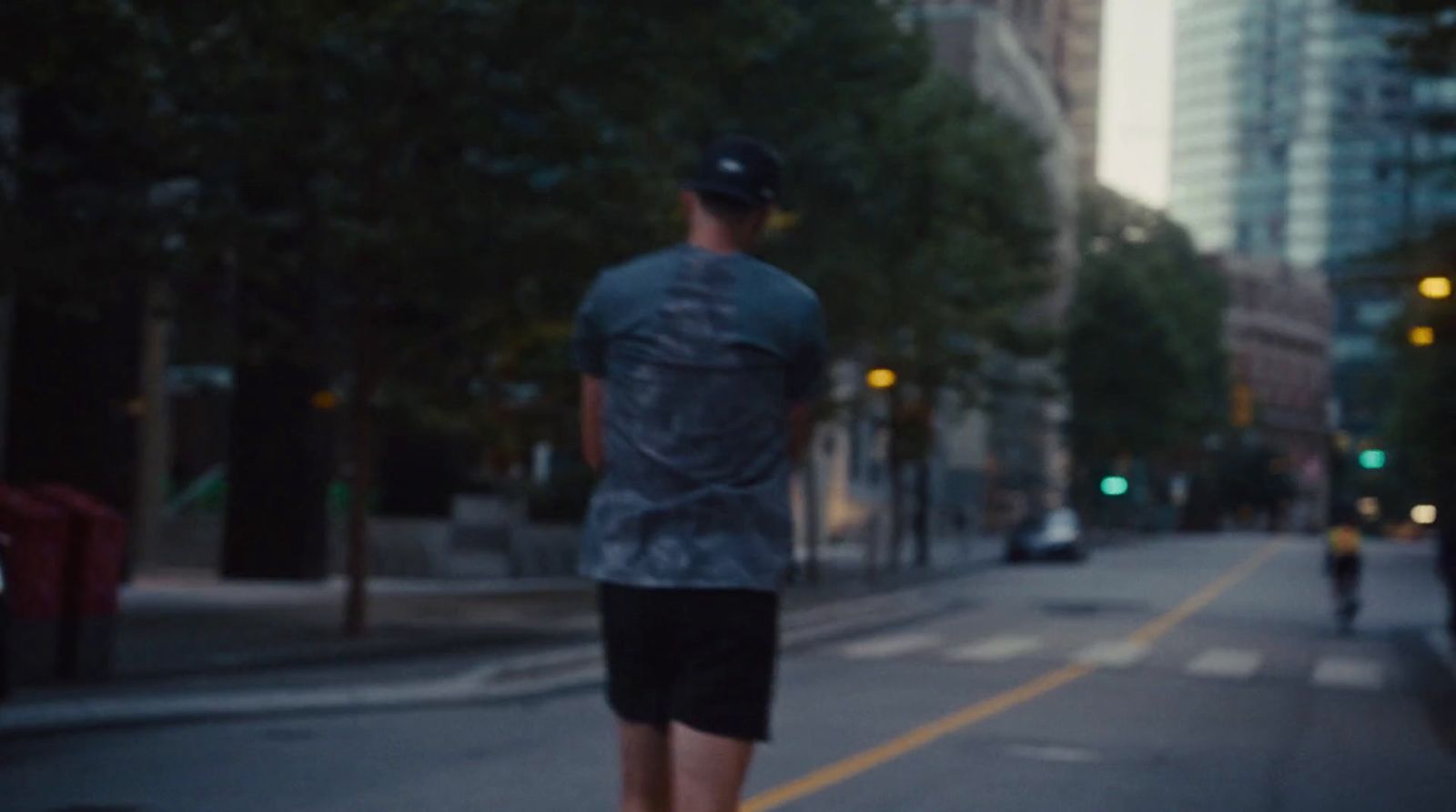 a man riding a skateboard down a street