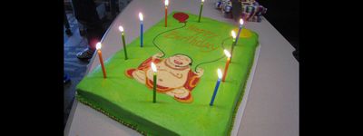 a birthday cake with candles on a table