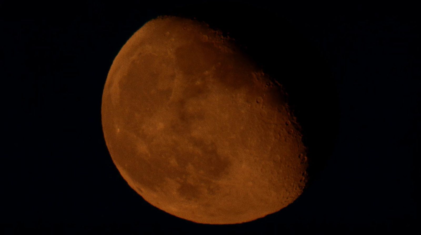 a close up of the moon in the dark sky