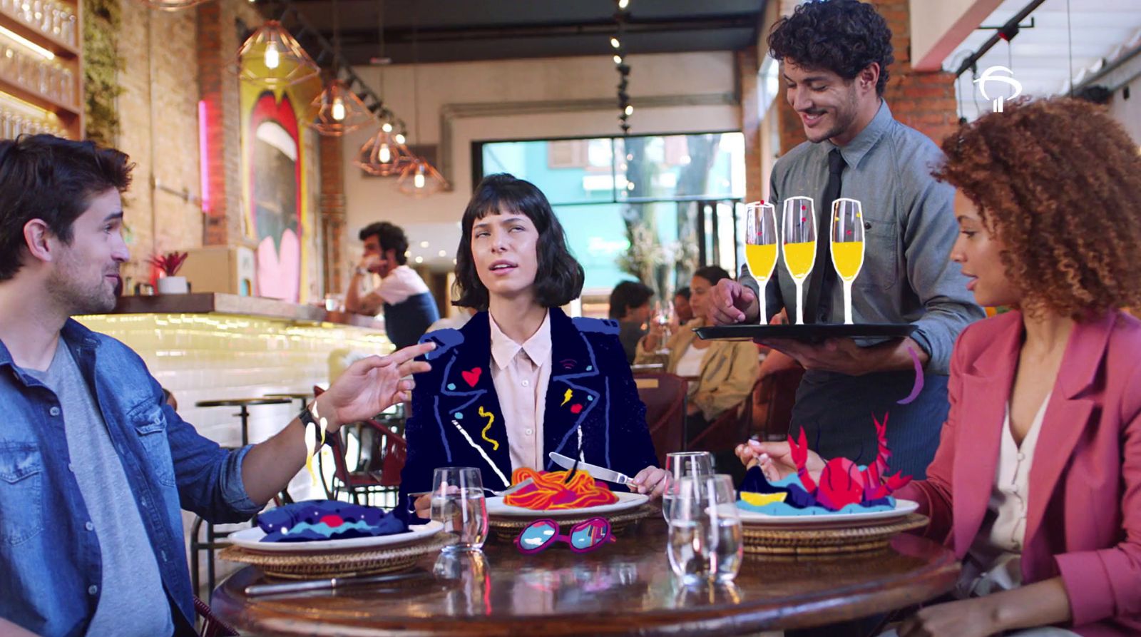 a group of people sitting around a table with plates of food