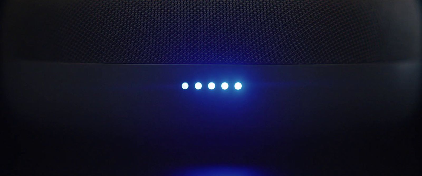 a close up of a speaker with four lights