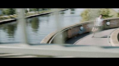 a man riding a skateboard down the side of a ramp