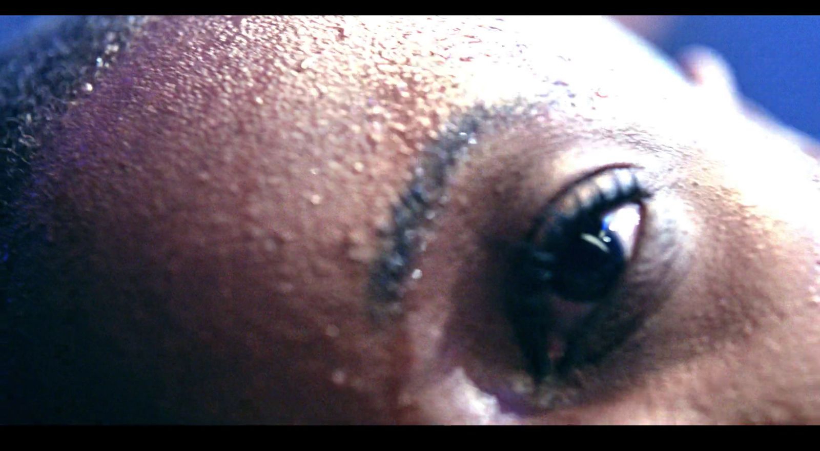 a close up of a person's eye with dirt on it