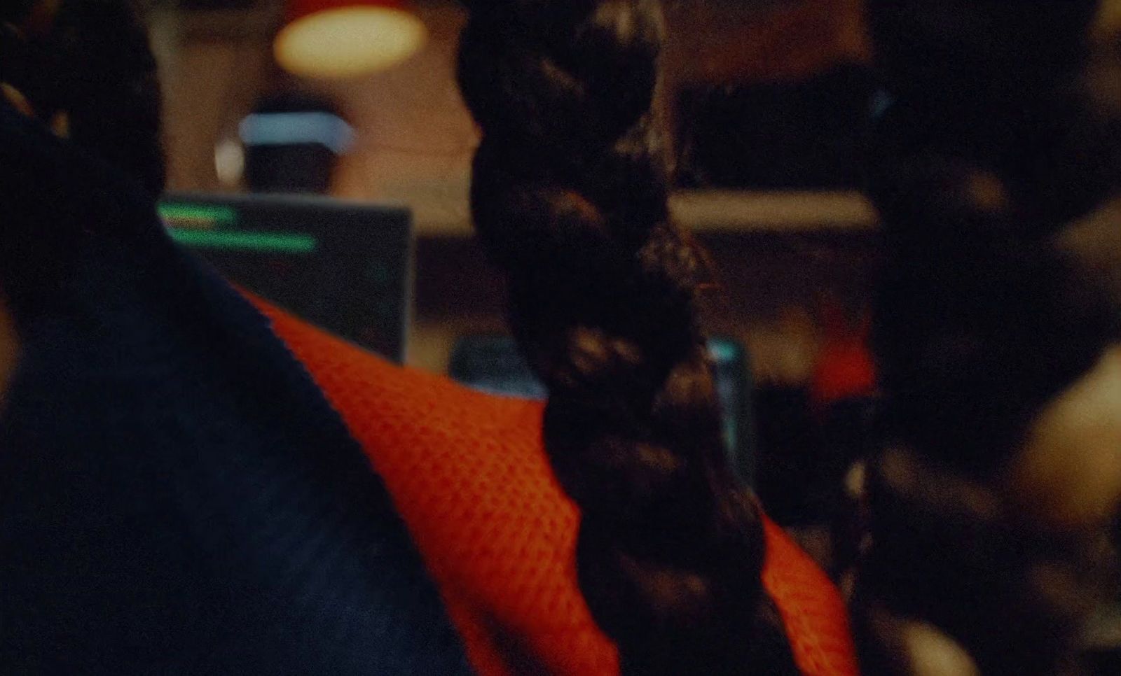 a close up of a person with a long braid