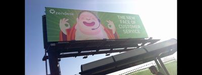 a billboard advertising a new face of customer service