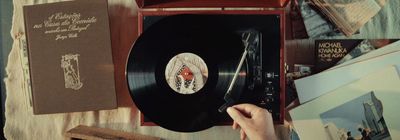 a record player sitting on top of a wooden table