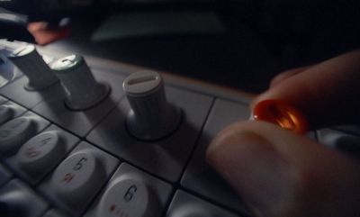 a close up of a person pressing buttons on a keyboard