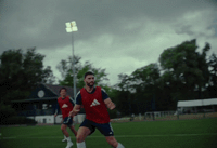 a couple of men playing a game of soccer