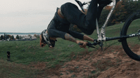 a man doing a trick on a bike in the air