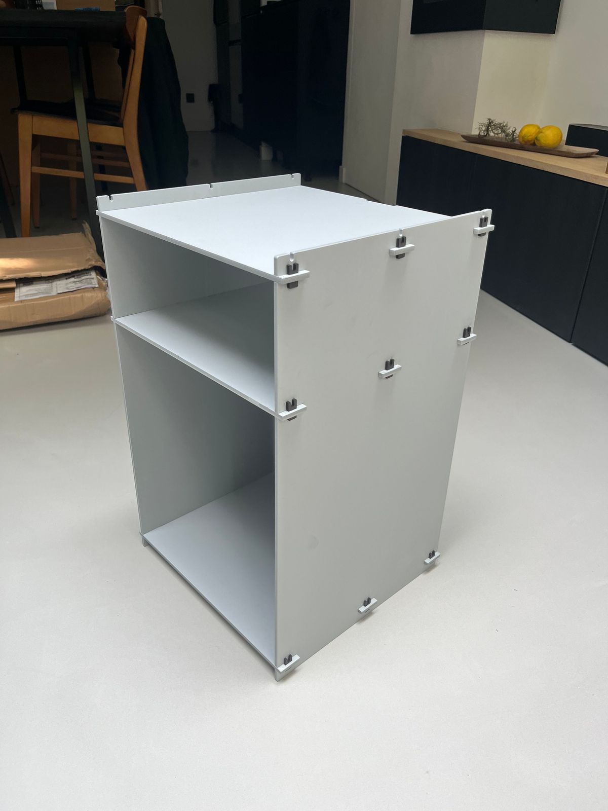a white shelf sitting on top of a white floor