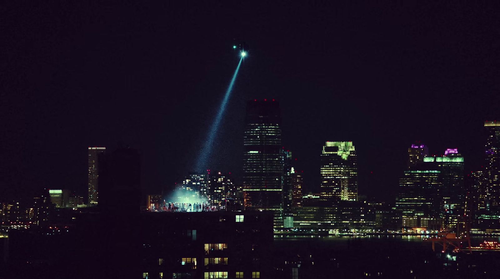 a view of a city at night with a light show