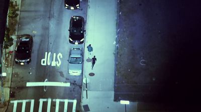 an overhead view of a parking lot at night