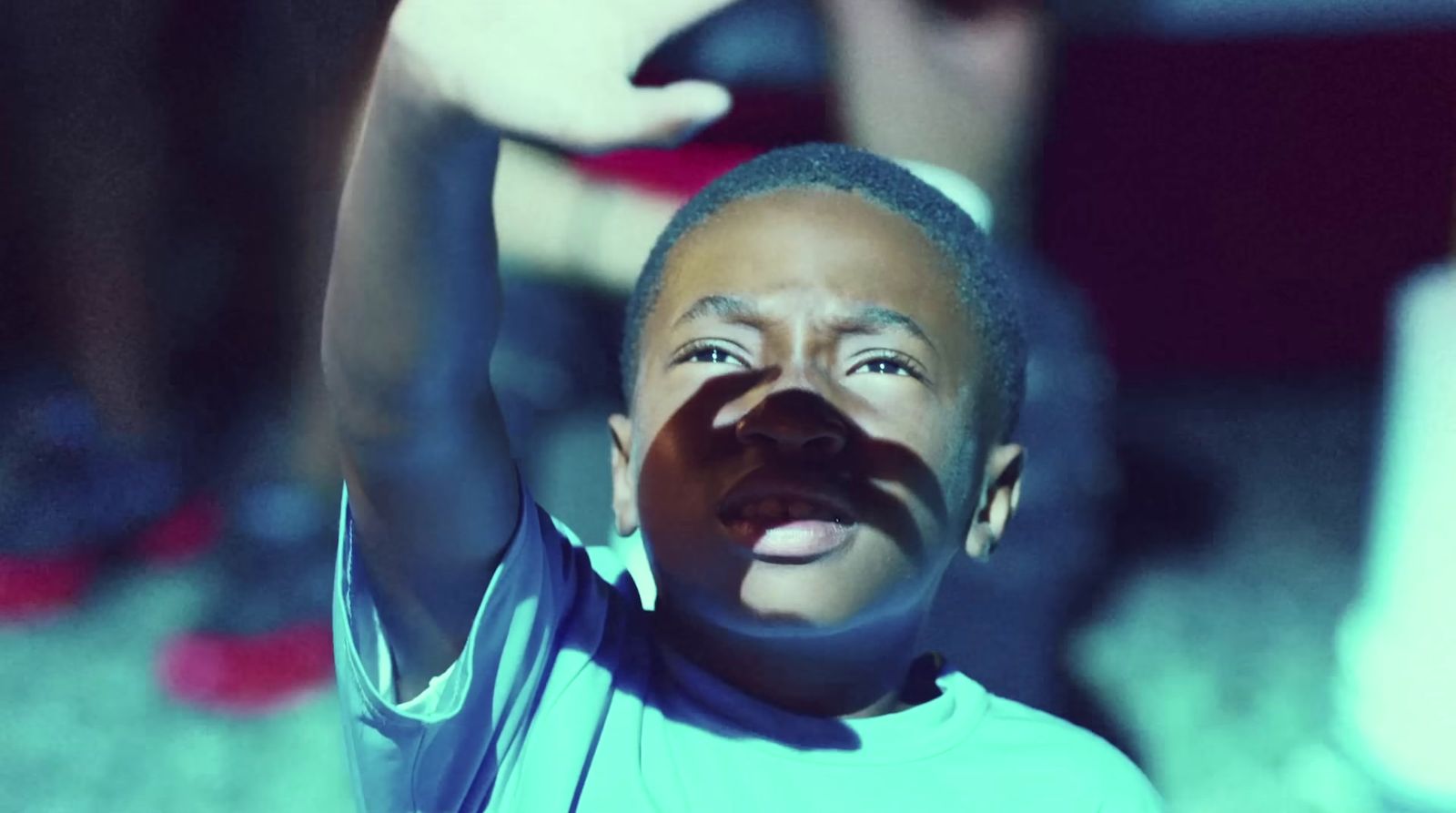 a young boy with a fake moustache on his face