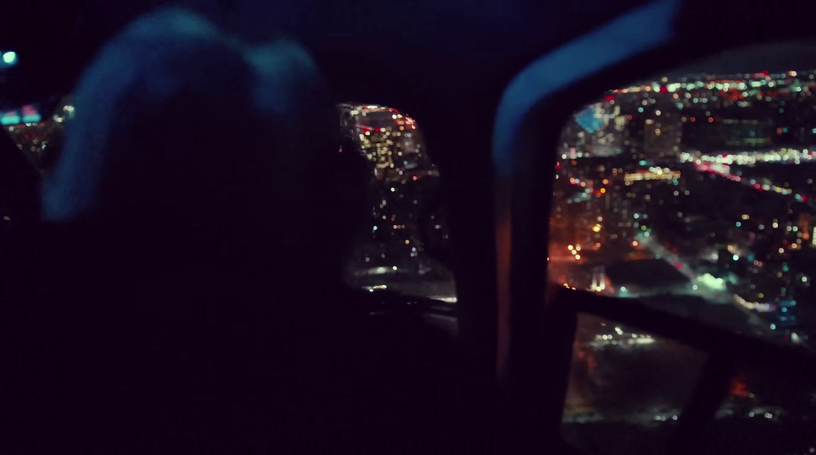 a view of a city at night from a plane