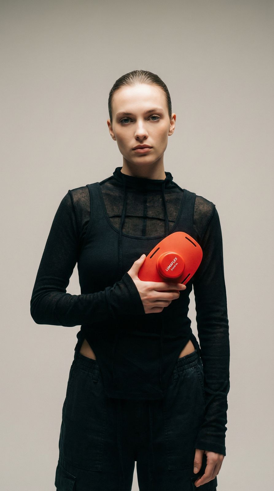 a woman holding a frisbee in her hands