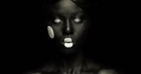 a woman with glowing eyes and black skin