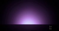 a dark room with a purple light in the middle