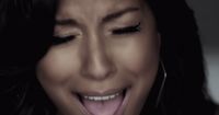 a close up of a person with her mouth open