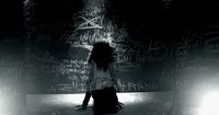 a woman standing in front of a wall covered in graffiti