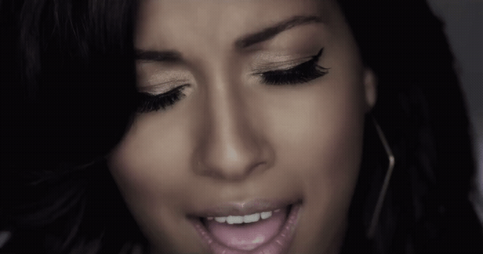 a close up of a person with her mouth open